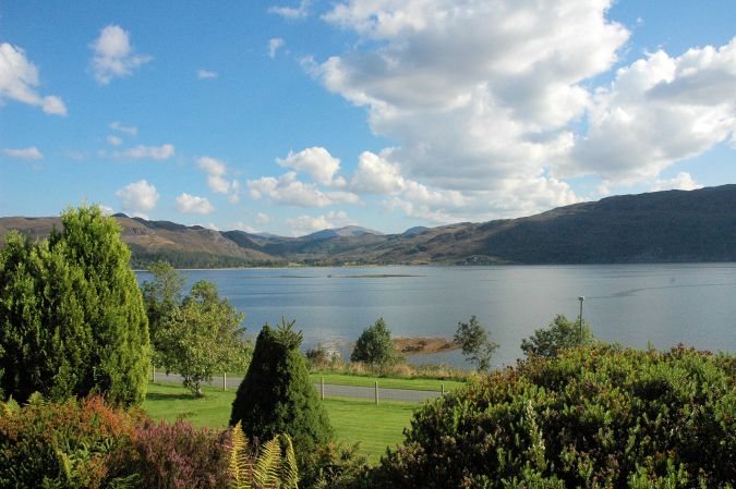 Strathardle stands in an elevated position above Croft Road, Lochcarron, and has magnificent sea and mountain views.