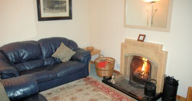 Bruaich Cottage, Lochcarron, has an comfortable and cosy lounge with an open fire.